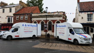A&M Removal vans outside a house