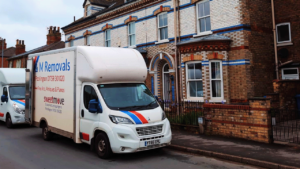 AM Removals van outside a house