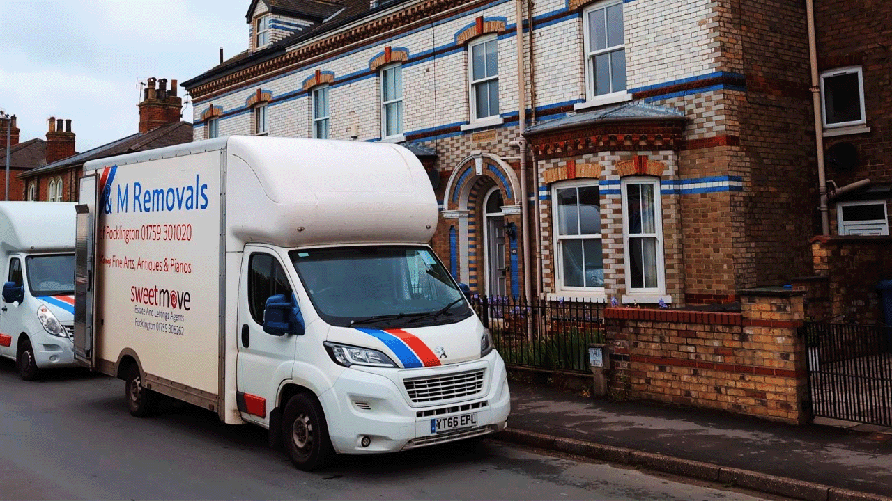 AM Removals van outside a house