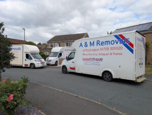A&M House removal vans outside a house