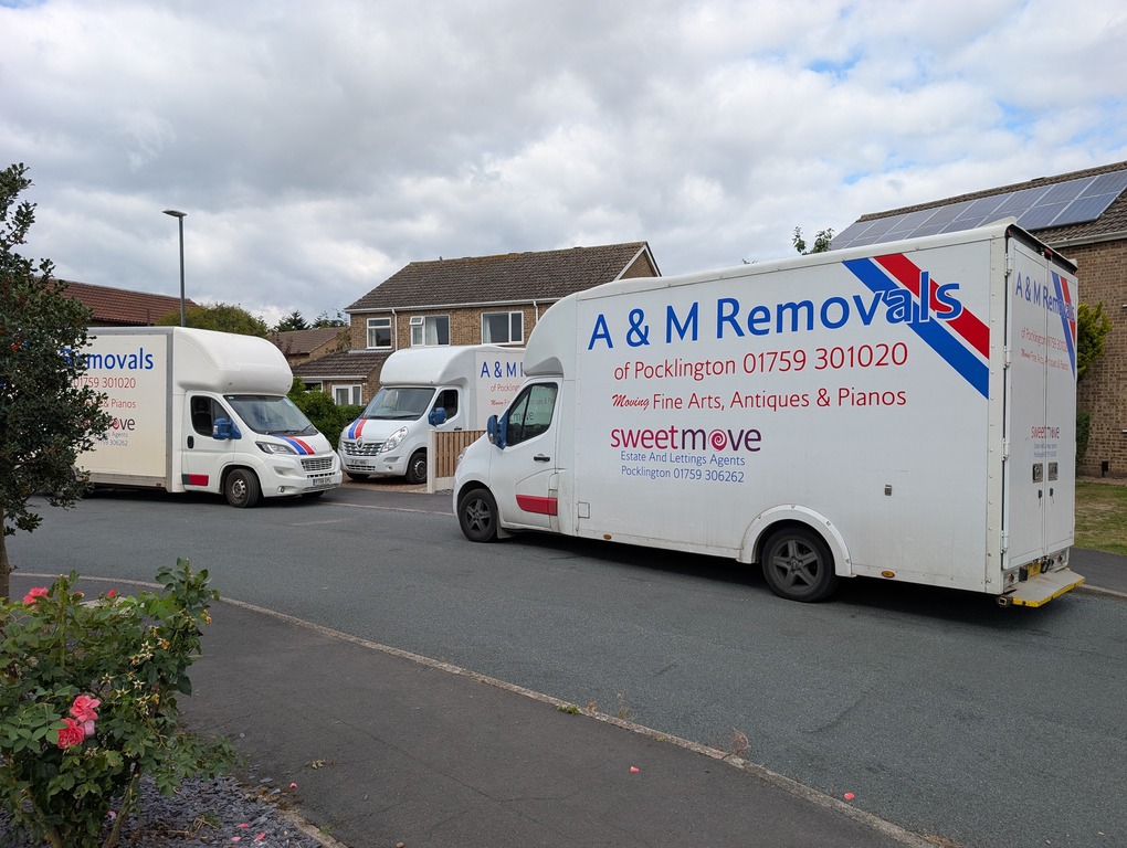 A&M House removal vans outside a house