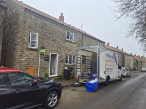 AM Removals parked out a house - moving in Pickering