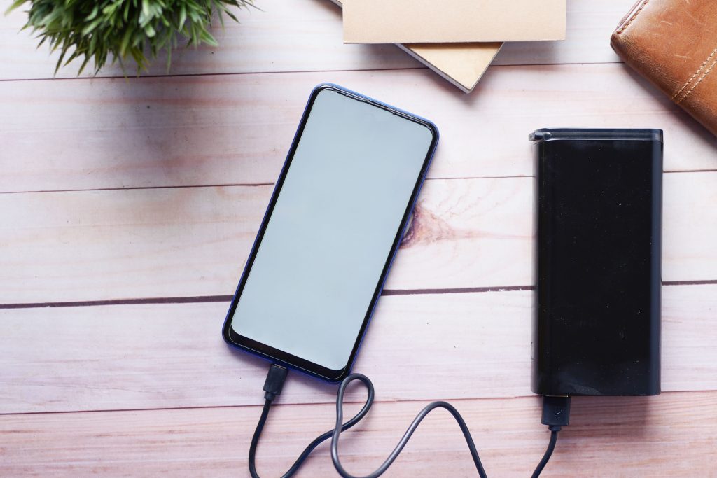 A mobile being charged | A&M Removals