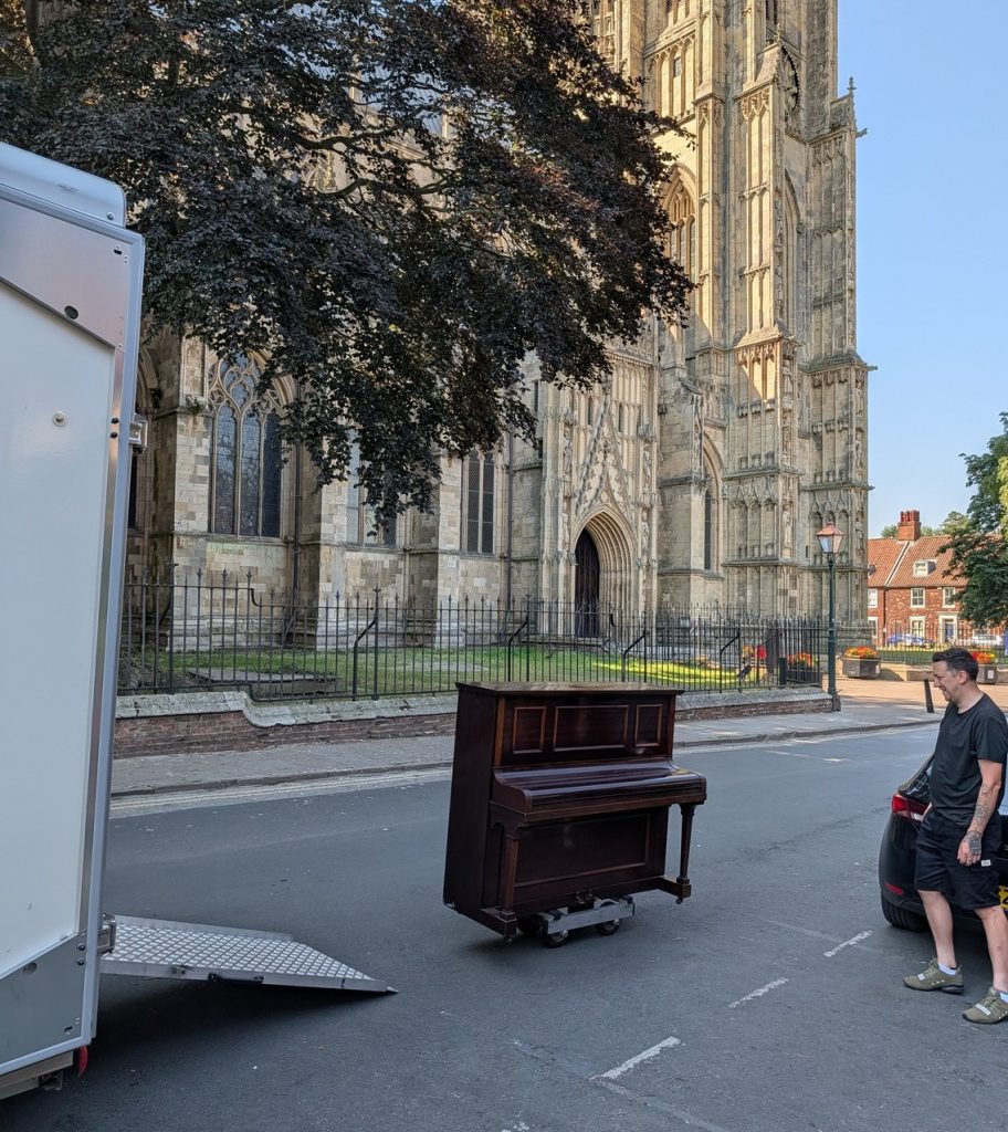 A piano outside Beverley Minster ready to be loaded into a removal van | A&M Removals