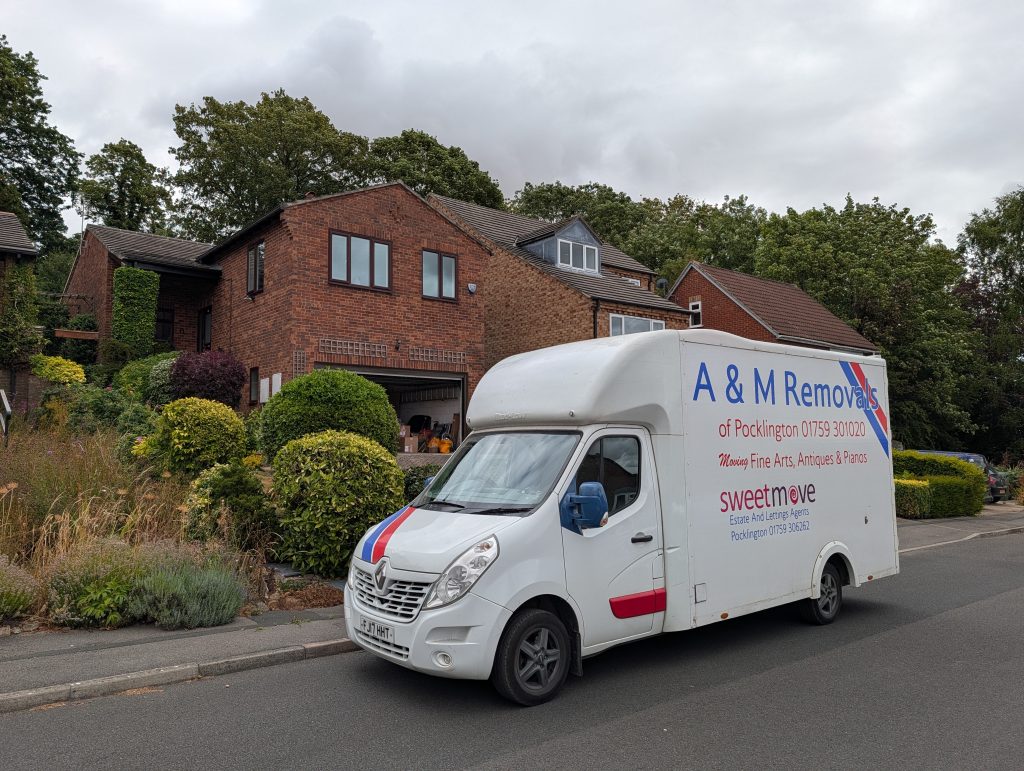 A&M Removals van outside a house in Pocklington, York