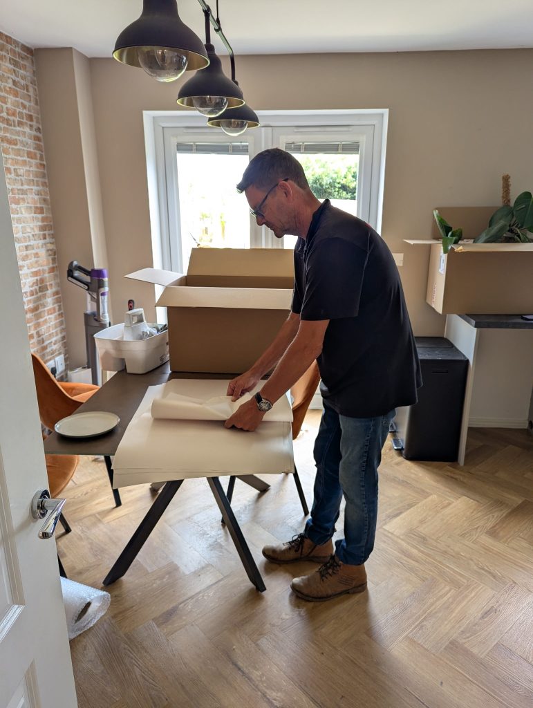 An A&M Removals expert packing for a house move...