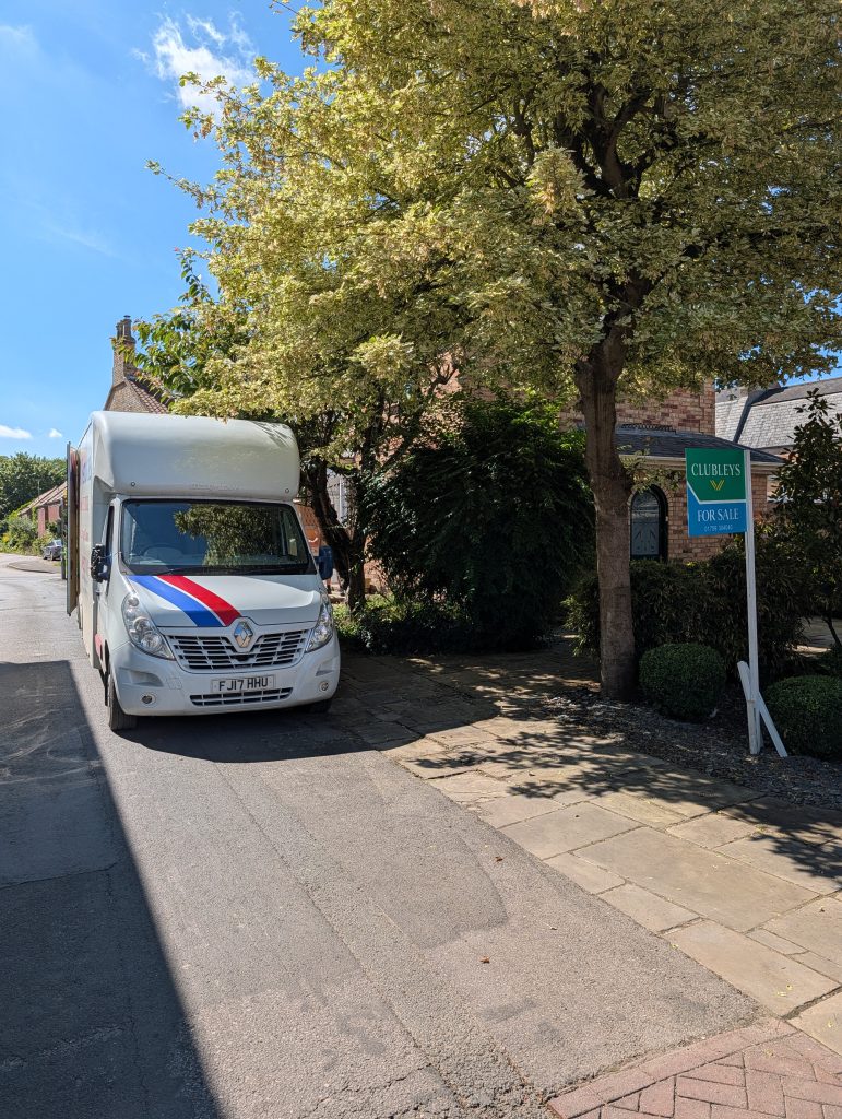 An A&M Removals van outside a house | A&M Removals