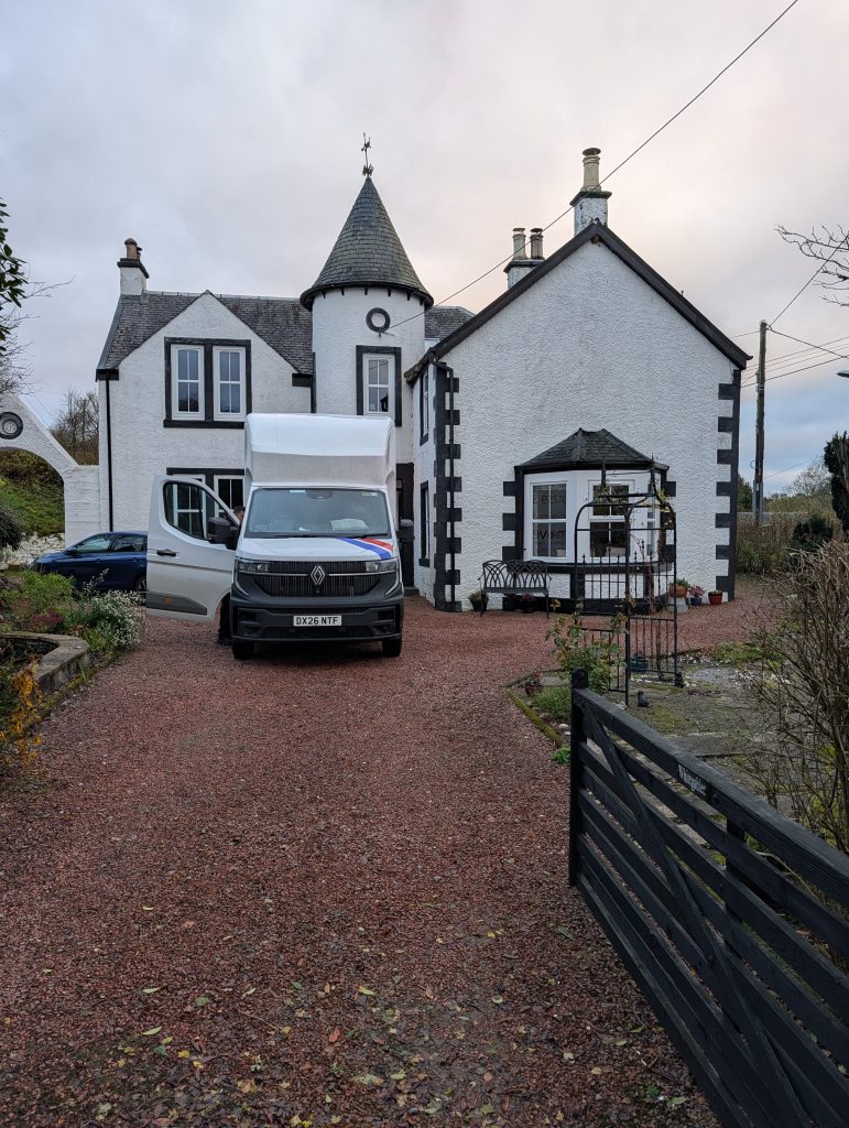 An A&M Removals van outside a house